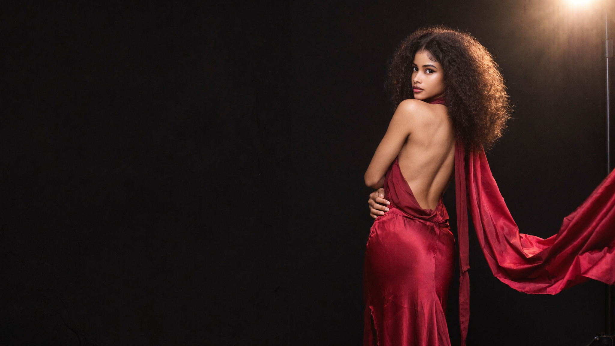 Cynsilhouette — founder Cynthia in the signature red silk